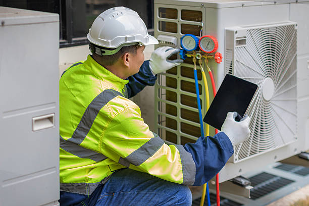 Professional Heat Pump Repair technician working in Ravena, NY